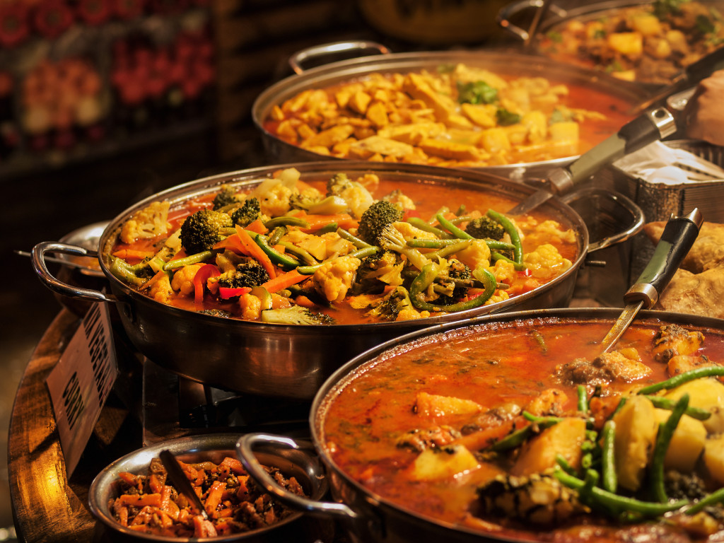 colorful curry food with different meats and vegetables