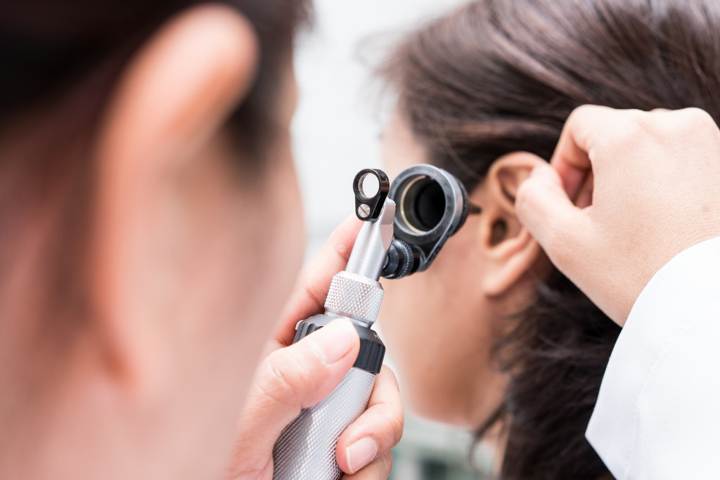 Doctor examined the patient's ear with Otoscope. Patient seem to have problems with hearing.