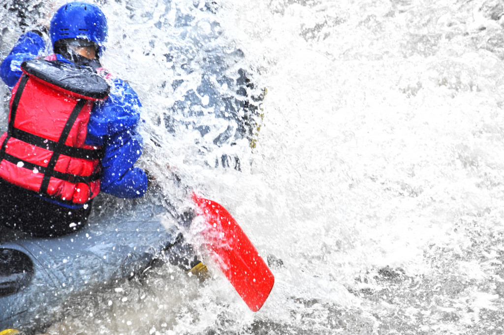 A person rafting on whitewater